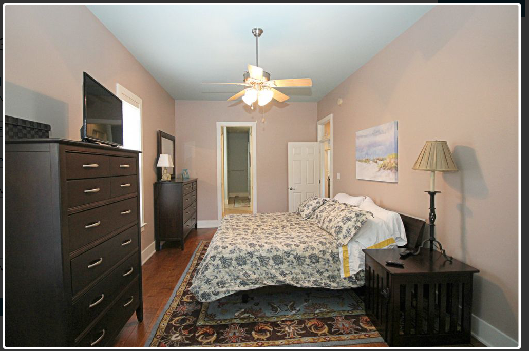King Bed dresser and chest and blue rug.png