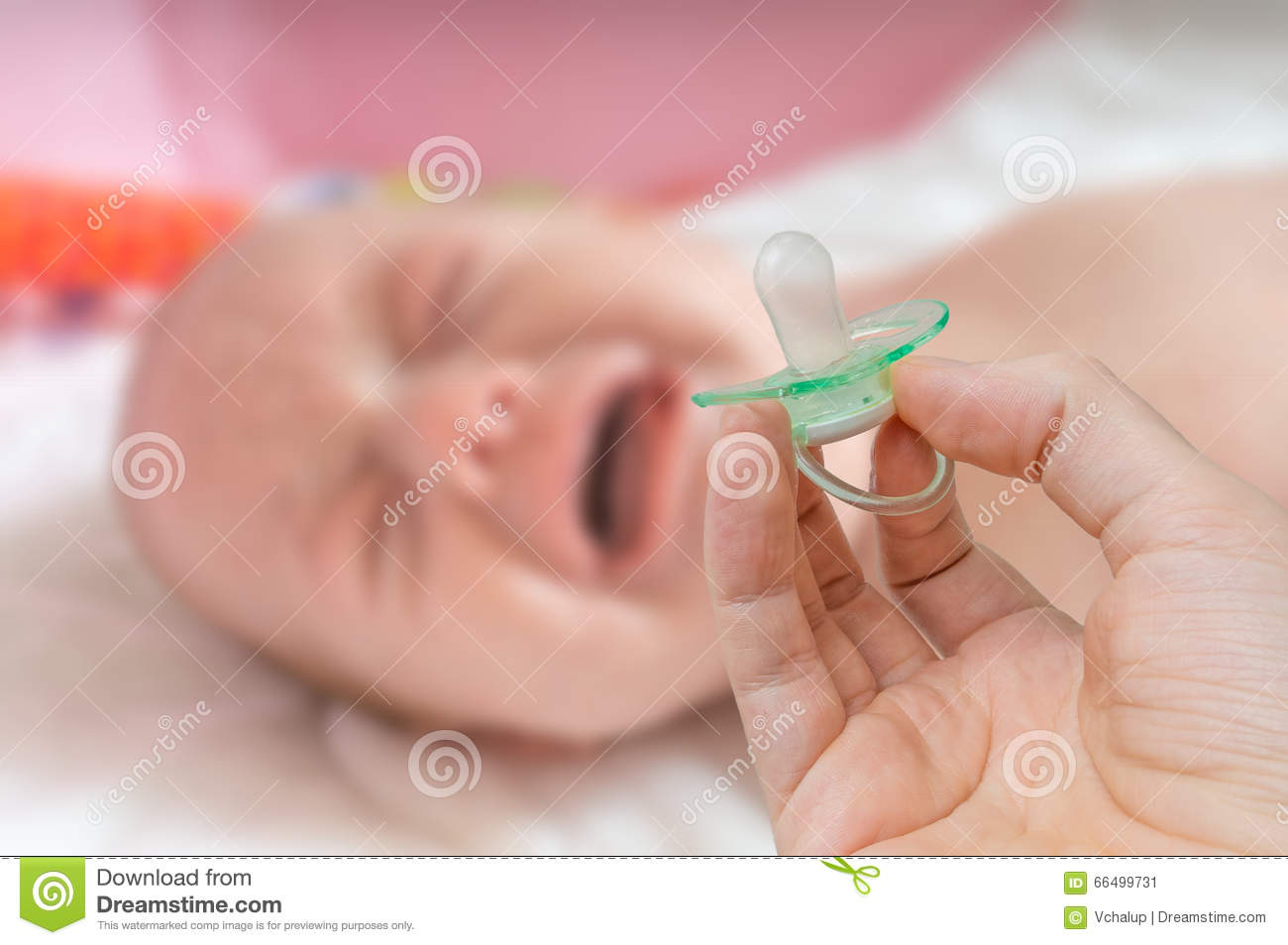 pacifier-hand-crying-baby-background-66499731.jpg